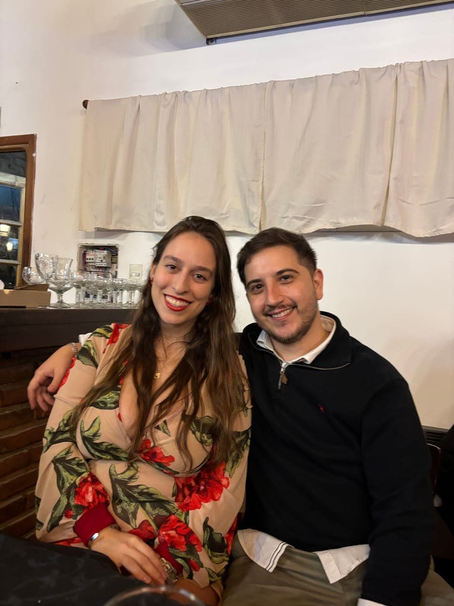 Mercedes and Michael at a table in a restaurant